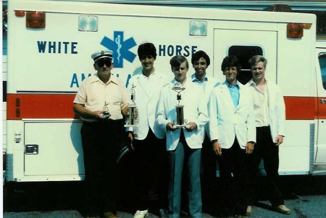 Chief Parmer (left) with the crew from Ambulance 4-9 with trophies from Honey Brook's 1986 Parade.